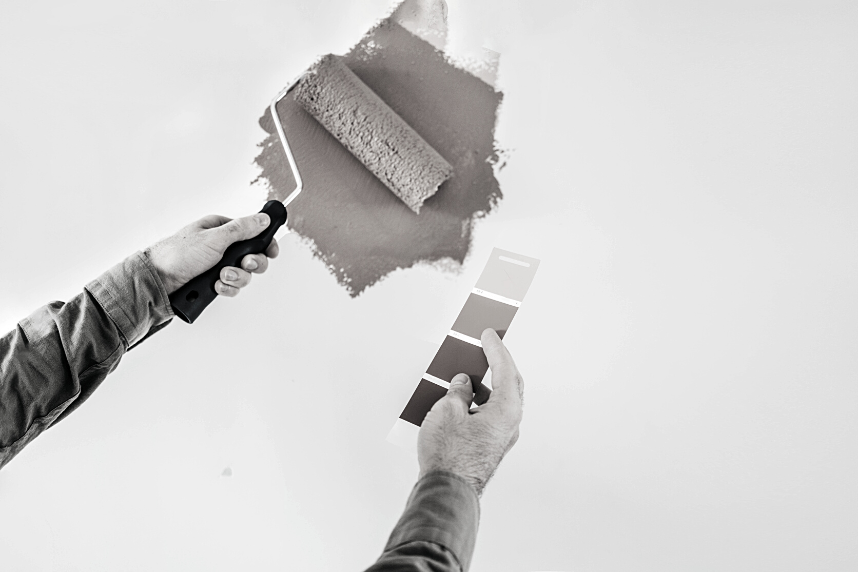 man painting wall.